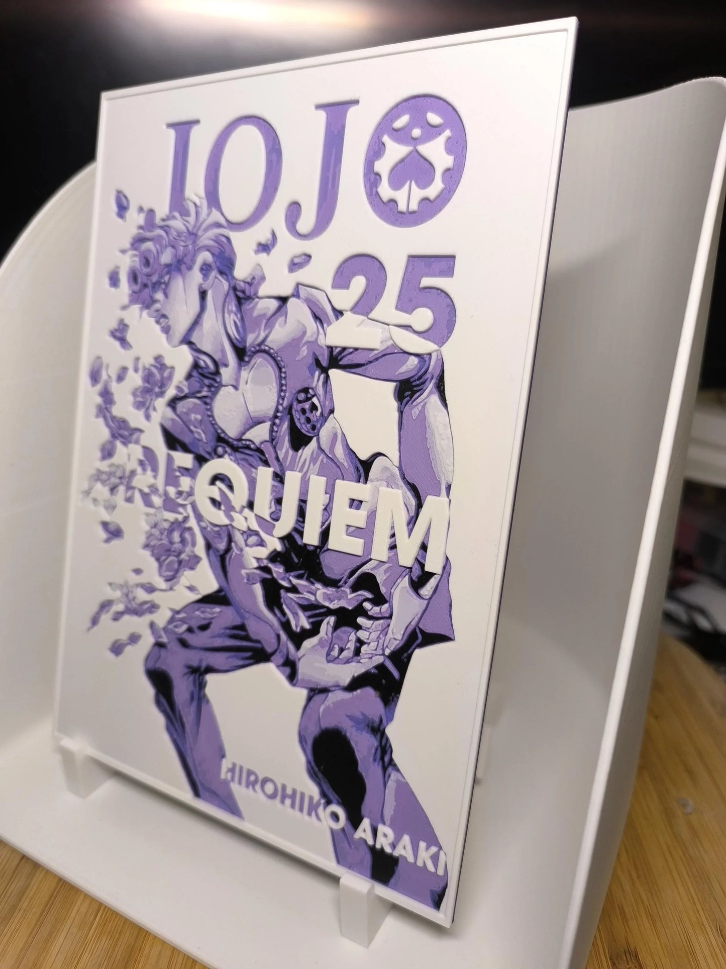 Livre manga JoJo 25 Requiem par Hirohiko Araki, couverture violette et blanche art stylisé