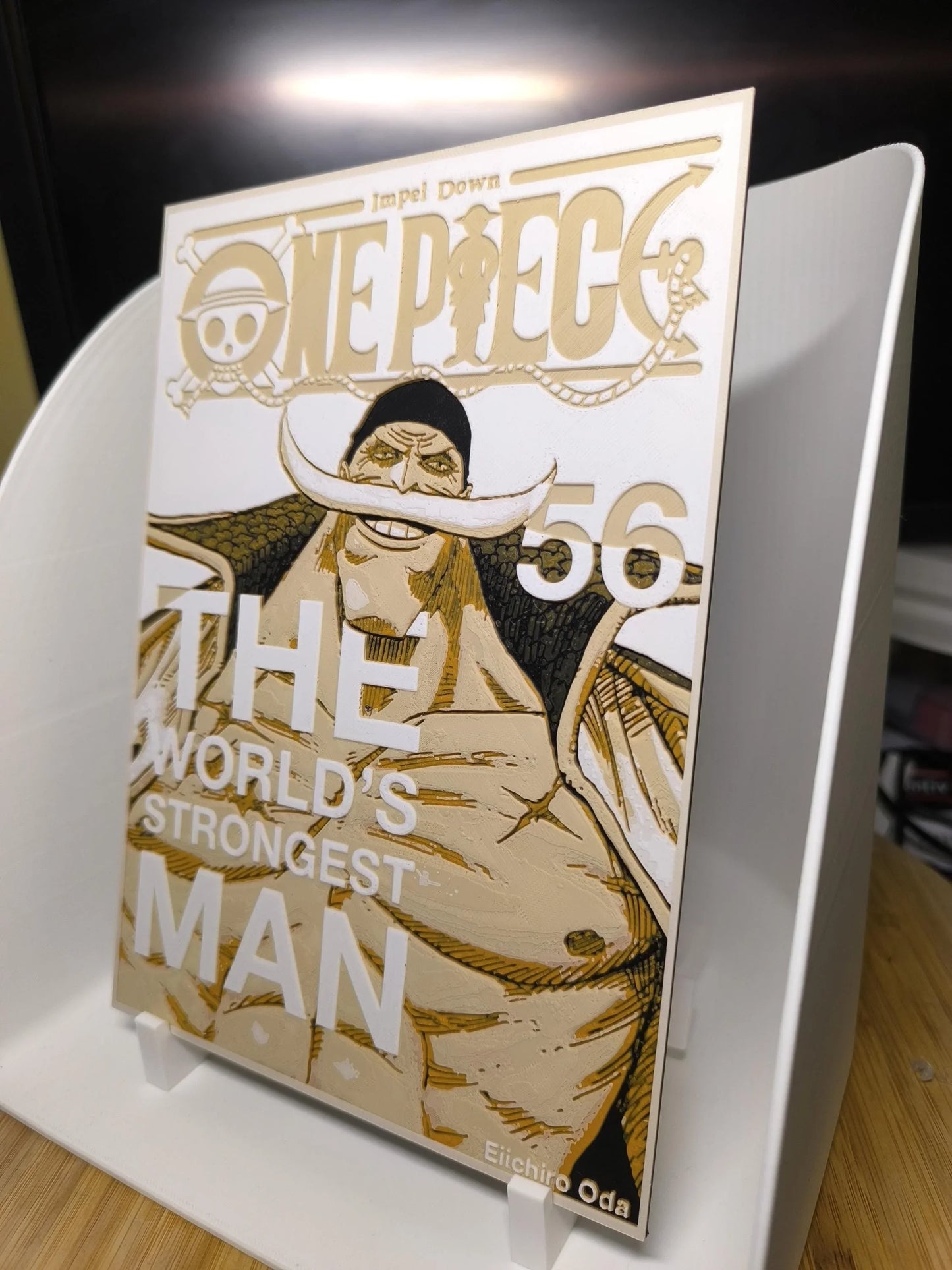Couverture manga One Piece volume 56 avec personnage barbu au large sourire, texte The World's Strongest Man