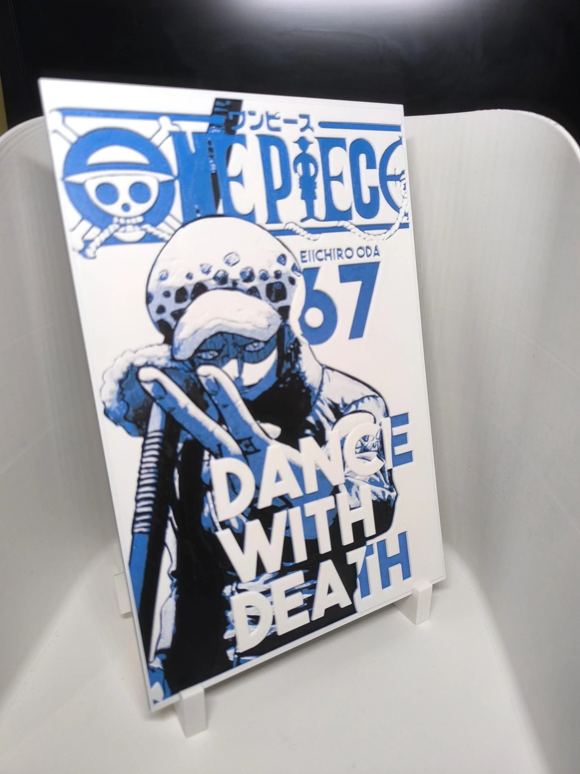 Couverture manga One Piece tome 67 avec personnage Trafalgar Law en bleu et noir, titre Dance With Death