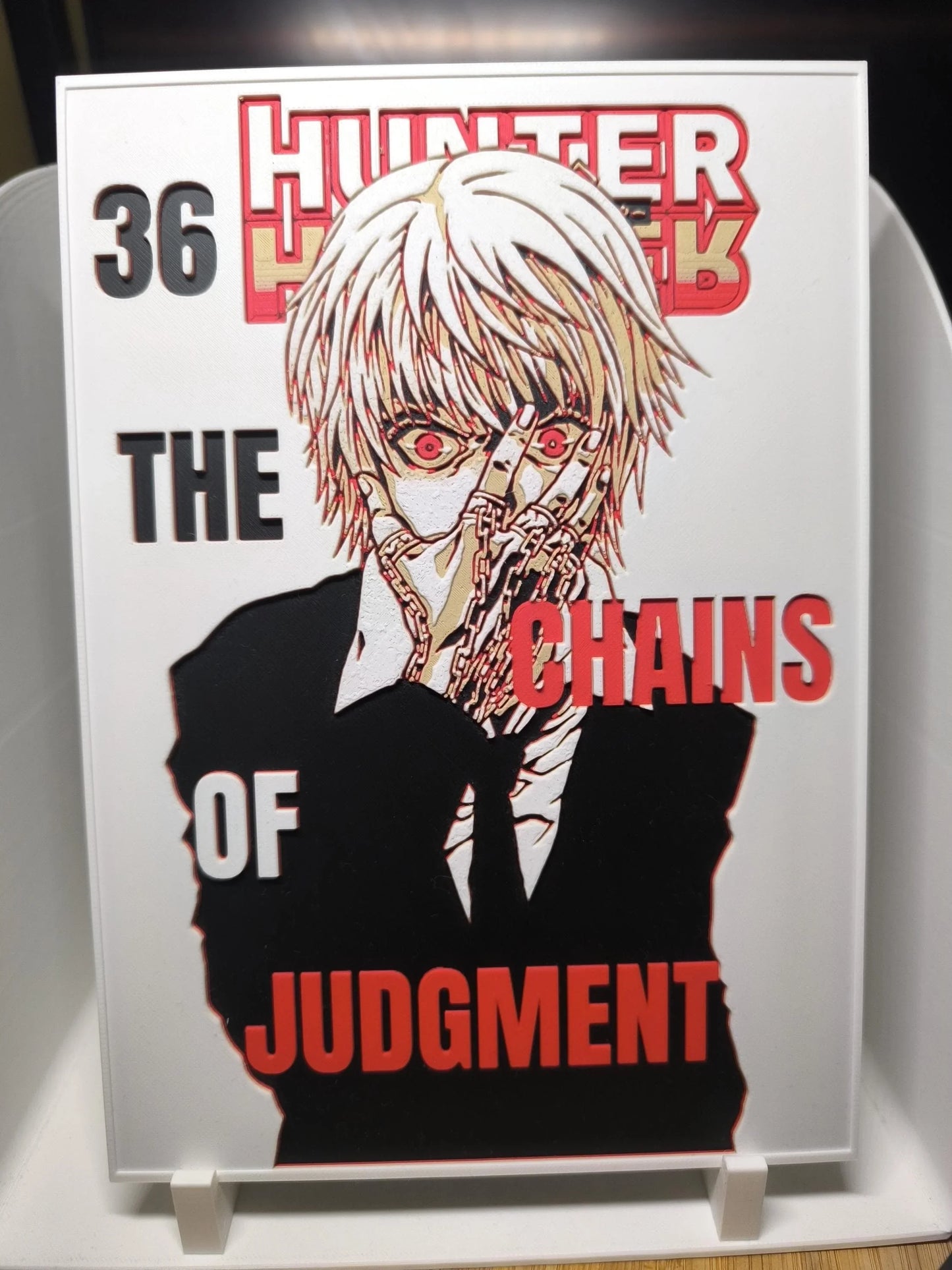 Couverture manga Hunter x Hunter volume 36 avec personnage aux cheveux blancs et chaînes sur main