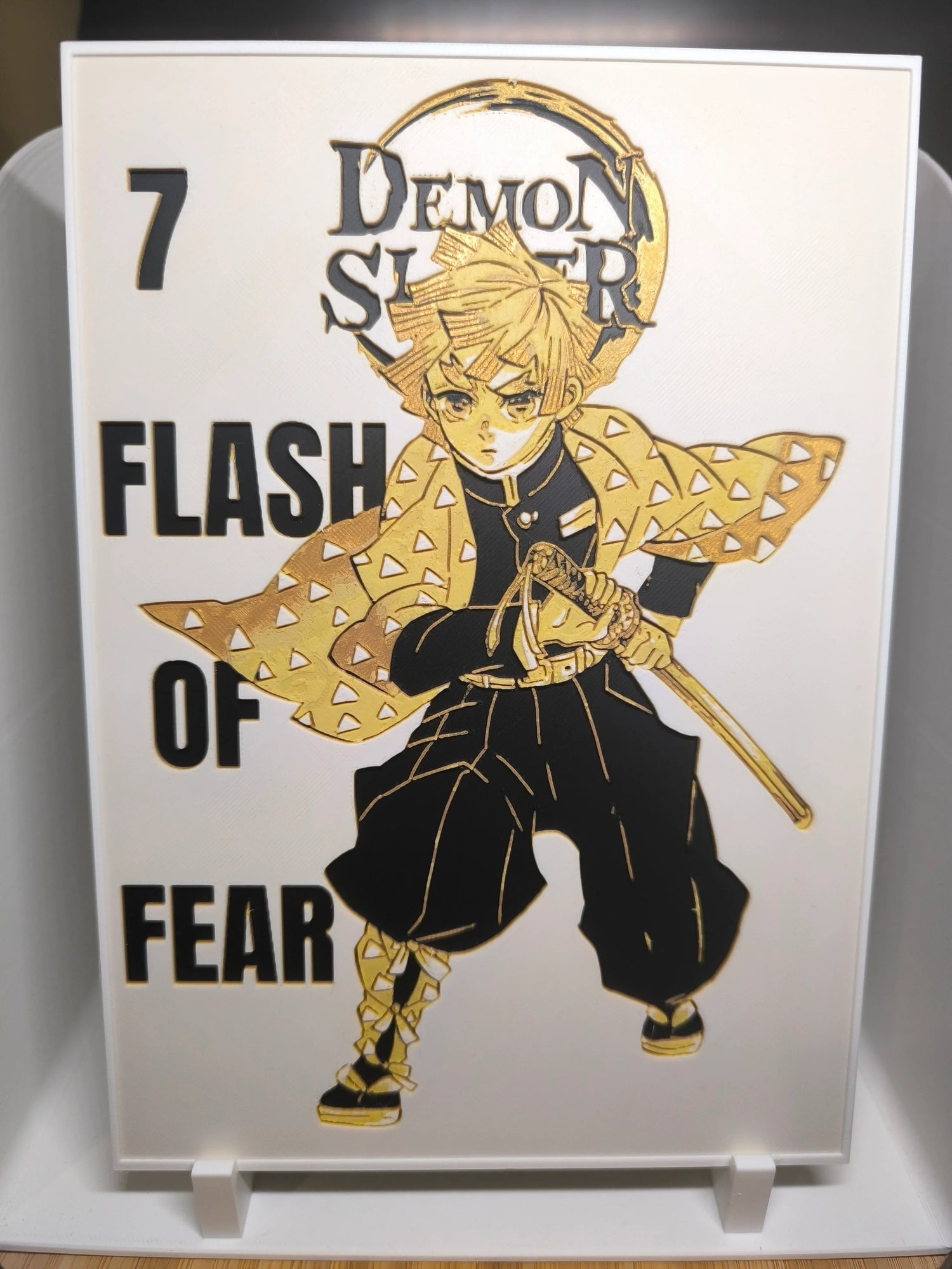 Illustration dorée et noire du personnage Tanjiro de Demon Slayer avec texte Flash of Fear
