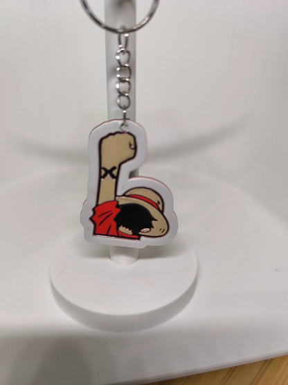 Porte-clés en acrylique avec dessin de poing levé et personnage en chapeau de paille rouge