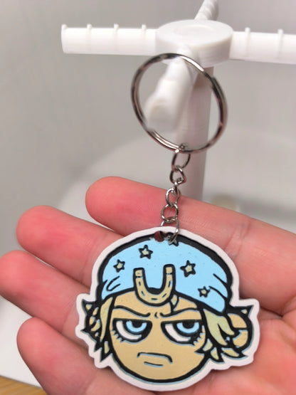 porte-clés avec personnage de dessin animé portant un bandeau bleu étoilé, style manga