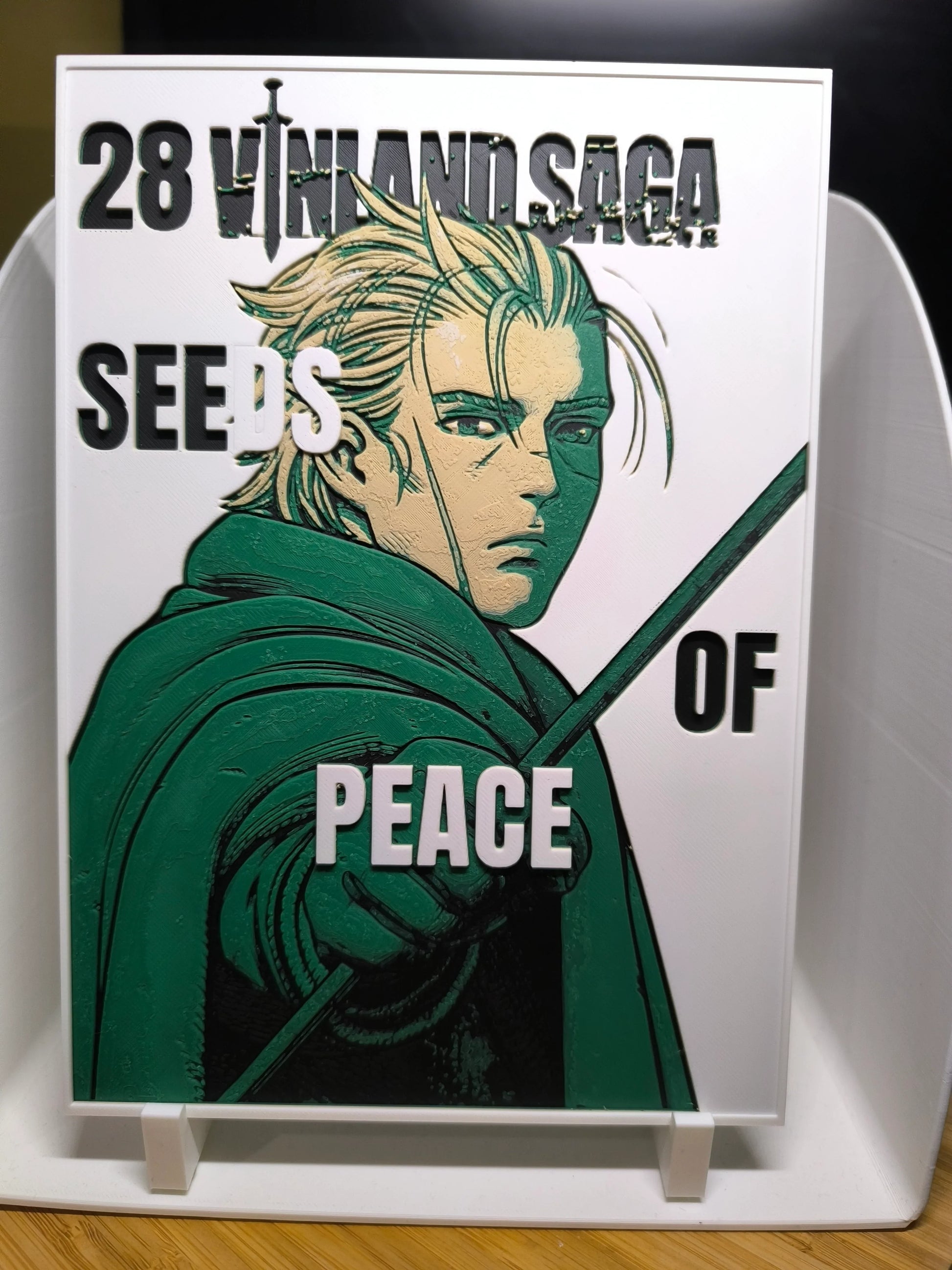 Couverture manga Vinland Saga tome 28 avec personnage blond au manteau vert et épée