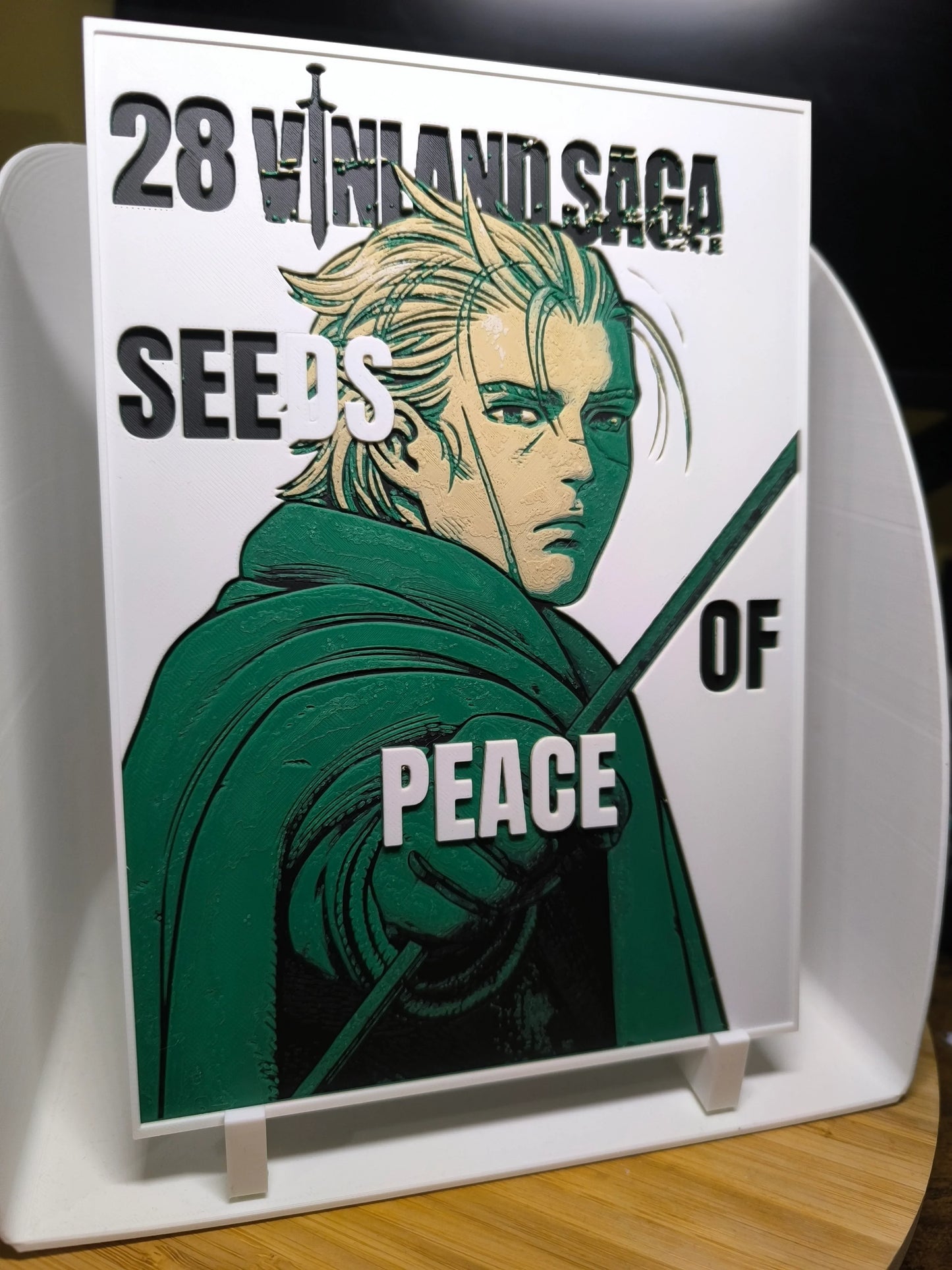 Plaque décorative 28 Vinland Saga Seeds of Peace avec personnage de manga au manteau vert et épée