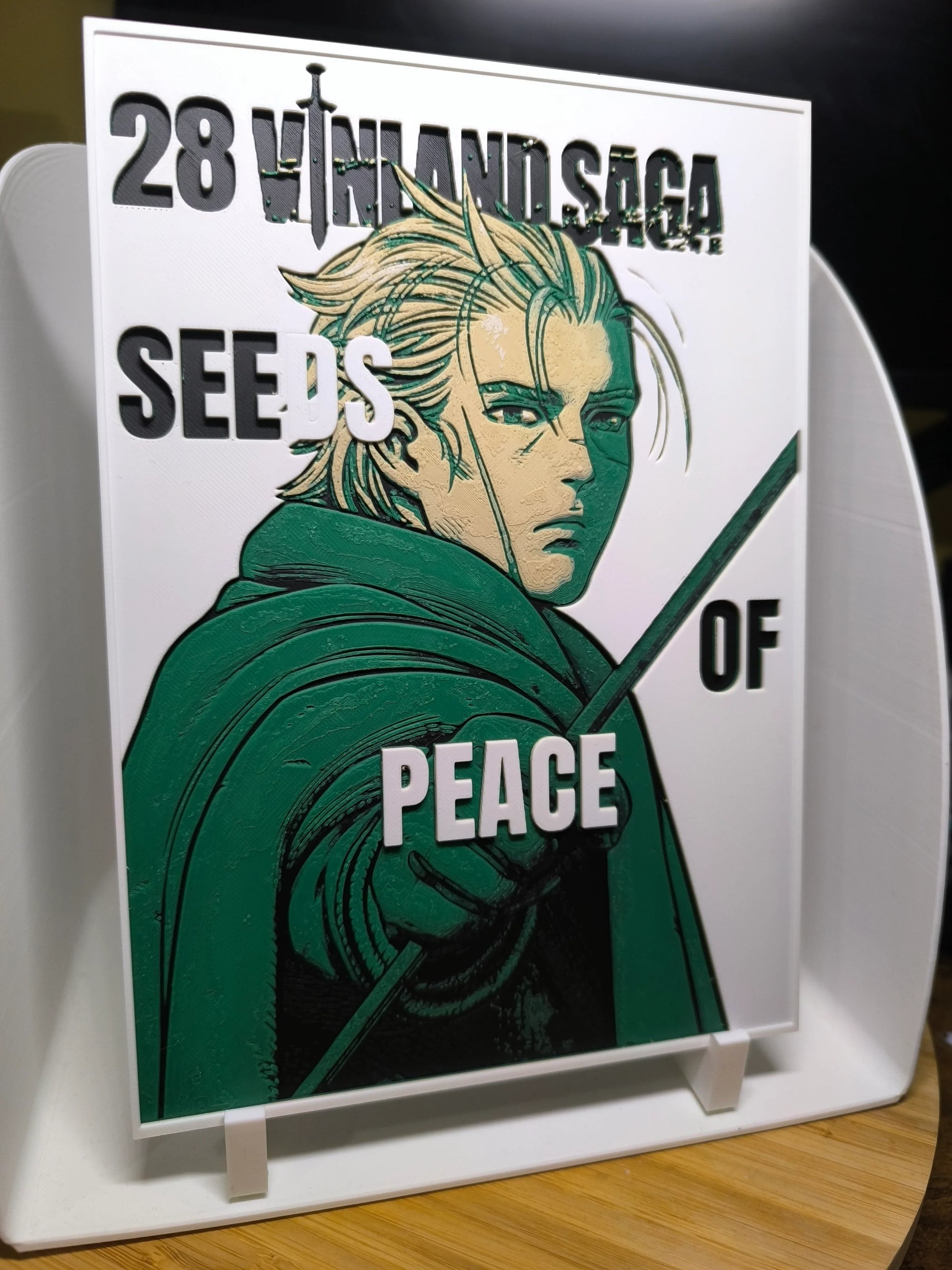 Plaque décorative 28 Vinland Saga Seeds of Peace avec personnage de manga au manteau vert et épée