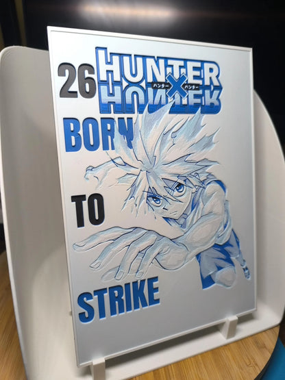 Impression de Hunter x Hunter volume 26 avec illustration de personnage dynamique en bleu et blanc