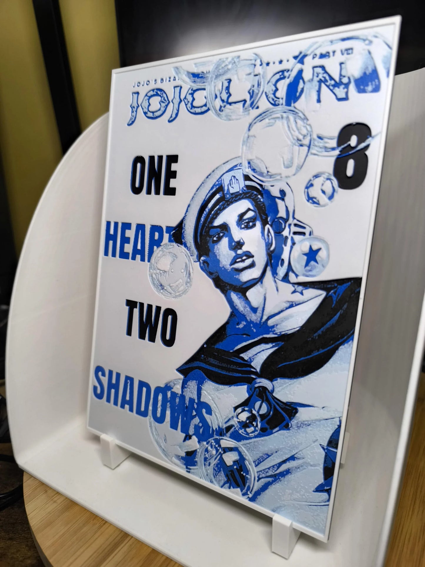 Illustration bleu et blanc de JoJo's Bizarre Adventure JoJolion Tome 8 avec texte One Heart Two Shadows